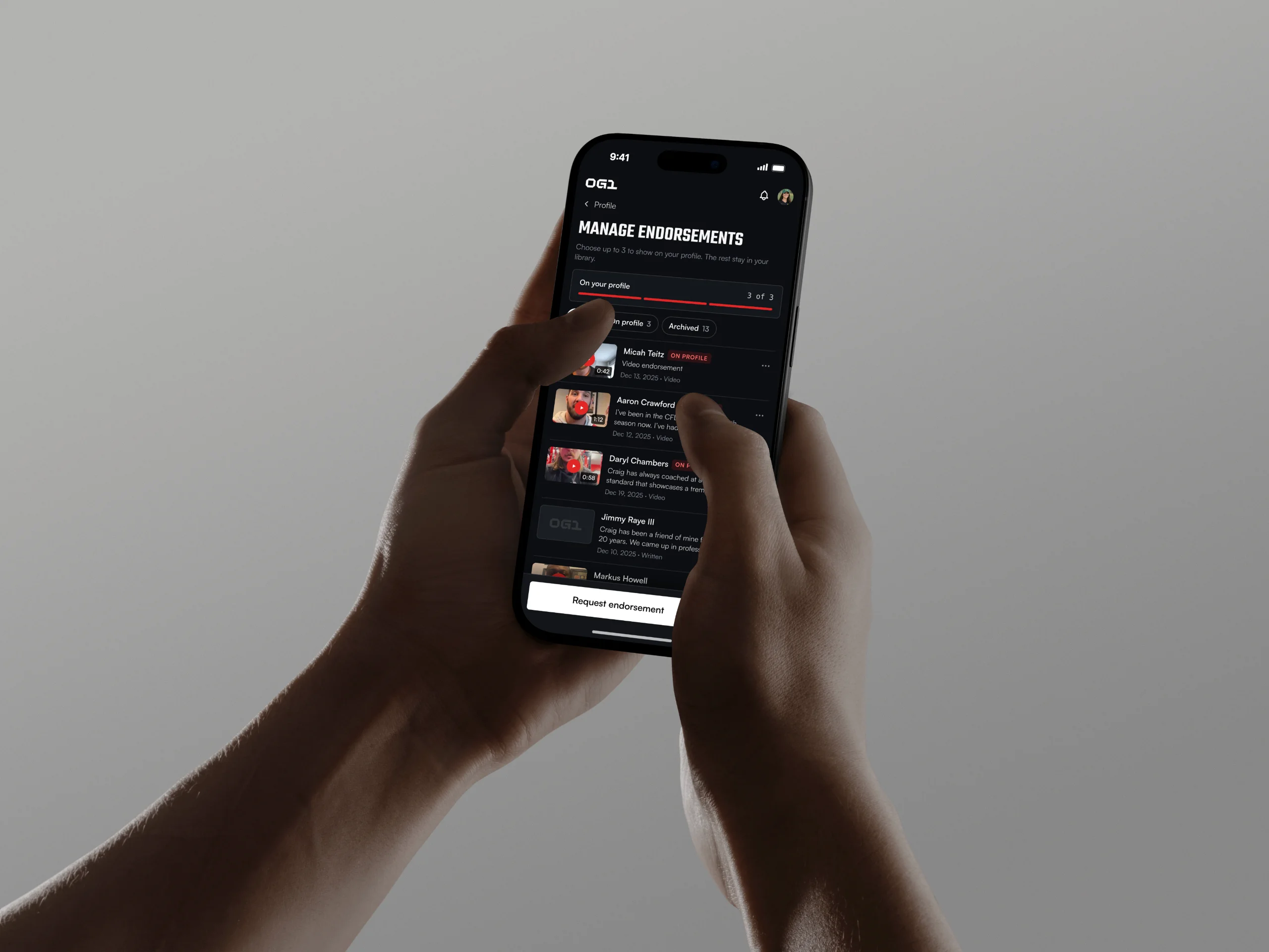 Hands hold a phone that shows the Manage endorsements screen in OG1.